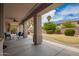 Covered patio with seating offers a relaxing outdoor space at 43228 W Knauss Dr, Maricopa, AZ 85138