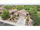 Expansive aerial view of a home featuring lush landscaping, a three car garage, and a tile roof at 5029 S Carlyle Dr, Gilbert, AZ 85298