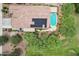 Aerial view of home with solar panels, tile roof, pool, and lush backyard at 5029 S Carlyle Dr, Gilbert, AZ 85298