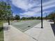 Community basketball court featuring hoops and green surface in a well-maintained neighborhood at 5029 S Carlyle Dr, Gilbert, AZ 85298
