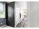 Bright bathroom featuring a black sliding barn door, tile accents, and modern vanity at 5029 S Carlyle Dr, Gilbert, AZ 85298