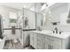 Modern bathroom featuring a dual sink vanity and tiled walk-in shower at 5029 S Carlyle Dr, Gilbert, AZ 85298