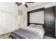 Comfortable bedroom featuring a sleek murphy bed and ample overhead lighting at 5029 S Carlyle Dr, Gilbert, AZ 85298