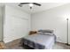 Relaxing bedroom features neutral carpet, a large closet, simple decor, and a ceiling fan at 5029 S Carlyle Dr, Gilbert, AZ 85298