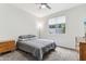 Comfortable bedroom features a large window for natural light, neutral carpet, and functional furnishings at 5029 S Carlyle Dr, Gilbert, AZ 85298