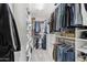 Spacious walk-in closet with custom shelving and ample storage for clothes and accessories at 5029 S Carlyle Dr, Gilbert, AZ 85298