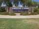 Landmark community signage for Layton Lakes with a waterfall feature and lush landscaping at 5029 S Carlyle Dr, Gilbert, AZ 85298