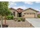 Charming single-Gathering home with a well-manicured front yard and two-car garage at 5029 S Carlyle Dr, Gilbert, AZ 85298