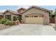Charming single-Gathering home with a well-manicured front yard and two-car garage at 5029 S Carlyle Dr, Gilbert, AZ 85298