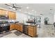 Open kitchen with stainless steel appliances and views into living area at 5029 S Carlyle Dr, Gilbert, AZ 85298