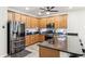 Kitchen featuring stainless steel appliances, granite countertops, and wood cabinetry at 5029 S Carlyle Dr, Gilbert, AZ 85298