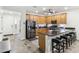 Stylish kitchen features wood cabinets, a center island, and stainless steel appliances at 5029 S Carlyle Dr, Gilbert, AZ 85298