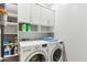 Well-organized laundry room equipped with modern washer and dryer and plenty of storage at 5029 S Carlyle Dr, Gilbert, AZ 85298