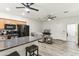 Open concept kitchen and living room area with modern appliances, breakfast bar, and comfortable seating at 5029 S Carlyle Dr, Gilbert, AZ 85298