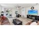 Comfortable living room with a large TV and sliding doors leading to outdoor area at 5029 S Carlyle Dr, Gilbert, AZ 85298