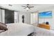 Spacious main bedroom features a tv and a sliding barn door to main bathroom at 5029 S Carlyle Dr, Gilbert, AZ 85298