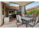 Relaxing covered outdoor patio featuring a TV, stylish furniture, and scenic backyard access at 5029 S Carlyle Dr, Gilbert, AZ 85298