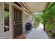 Cozy covered patio featuring a grill, lush greenery, and privacy from the elements at 5029 S Carlyle Dr, Gilbert, AZ 85298