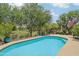 Refreshing pool showcasing lush landscaping and views of the adjacent golf course at 5029 S Carlyle Dr, Gilbert, AZ 85298