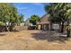 Expansive backyard with block fence, shade trees, and patio, perfect for outdoor living at 508 W San Angelo St, Gilbert, AZ 85233