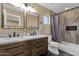 Bathroom featuring double sinks, a shower-tub combo, and modern fixtures at 508 W San Angelo St, Gilbert, AZ 85233