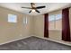 Bright bedroom with natural light, featuring two windows and a ceiling fan at 508 W San Angelo St, Gilbert, AZ 85233