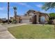 Spacious two-story home with a well-manicured lawn, multi-car garage and desert landscaping at 508 W San Angelo St, Gilbert, AZ 85233