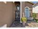 Elegant front entrance featuring decorative columns and a beautiful tile porch at 508 W San Angelo St, Gilbert, AZ 85233