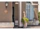 Inviting front porch with a statue, small table, and chairs, creating a welcoming entrance at 508 W San Angelo St, Gilbert, AZ 85233