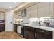 Modern kitchen features dark cabinets, light countertops, and updated appliances, designed for culinary enthusiasts at 508 W San Angelo St, Gilbert, AZ 85233