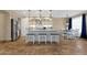 Bright kitchen boasts a kitchen island with seating and stainless-steel appliances, perfect for cooking and dining at 508 W San Angelo St, Gilbert, AZ 85233