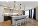 Kitchen island features bar seating, stylish pendant lighting, and a functional design for modern living at 508 W San Angelo St, Gilbert, AZ 85233
