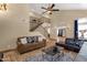 Elegant living room featuring a staircase, high ceilings, comfortable seating, and tile flooring at 508 W San Angelo St, Gilbert, AZ 85233