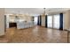 Open floorplan with tile flooring, seamlessly connecting the kitchen, dining, and living areas for easy entertaining at 508 W San Angelo St, Gilbert, AZ 85233