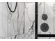 Detailed view of a modern shower featuring elegant marble tiles and sleek black fixtures at 508 W San Angelo St, Gilbert, AZ 85233