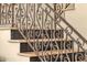 Elegant staircase with decorative iron railing and stone steps, showcasing craftsmanship at 508 W San Angelo St, Gilbert, AZ 85233