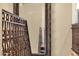 Stairwell features wrought iron handrail and detailed mirror at 508 W San Angelo St, Gilbert, AZ 85233