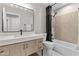 Modern bathroom featuring stylish vanity, mirror, and shower with decorative tiling at 512 W Encinas St, Gilbert, AZ 85233