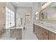 Luxury bathroom featuring a soaking tub, walk-in shower, and modern vanity at 512 W Encinas St, Gilbert, AZ 85233