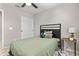 Comfortable bedroom features a cozy bed, side table and neutral color palette at 512 W Encinas St, Gilbert, AZ 85233