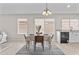 Cozy dining area with modern table setting, stylish rug, and plenty of natural light at 512 W Encinas St, Gilbert, AZ 85233