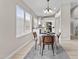 Bright dining area featuring stylish furnishings and a view of the updated kitchen at 512 W Encinas St, Gilbert, AZ 85233