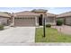 Charming single-story home featuring a well-manicured lawn and inviting curb appeal at 512 W Encinas St, Gilbert, AZ 85233