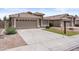 Charming single-story home with a well-manicured front yard and a spacious two-car garage at 512 W Encinas St, Gilbert, AZ 85233