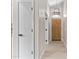 Inviting hallway with wood-look flooring, leading to a paneled front door at 512 W Encinas St, Gilbert, AZ 85233
