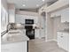 Modern kitchen with white cabinets, sleek countertops, and black appliances for a modern look at 512 W Encinas St, Gilbert, AZ 85233