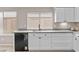 Bright kitchen featuring updated appliances, sleek countertops, and white cabinetry at 512 W Encinas St, Gilbert, AZ 85233