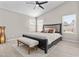 Bright main bedroom showcasing a large bed, vaulted ceiling, and ample natural light at 512 W Encinas St, Gilbert, AZ 85233