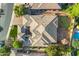 Aerial view of property with putting green, gazebo, outdoor seating, manicured backyard, and unique roofline at 5291 S Bradshaw Pl, Chandler, AZ 85249