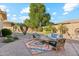Inviting backyard space with outdoor seating area and a vibrant colorful rug at 5291 S Bradshaw Pl, Chandler, AZ 85249